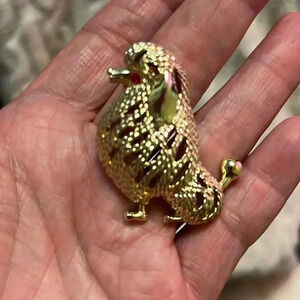 Vintage 1970 Sarah Coventry “Suzette” Gold Sitting Poodle Brooch.